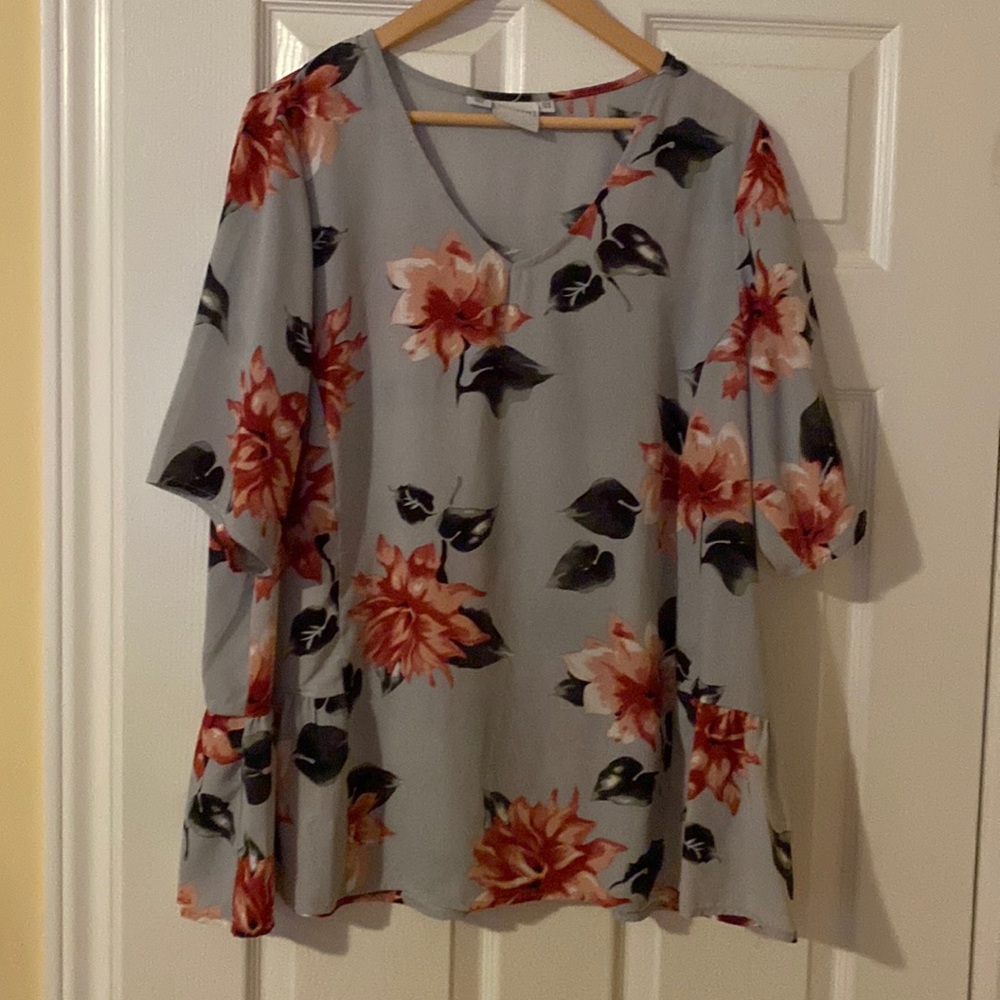 Plus size grey/blue floral short sleeve blouse.